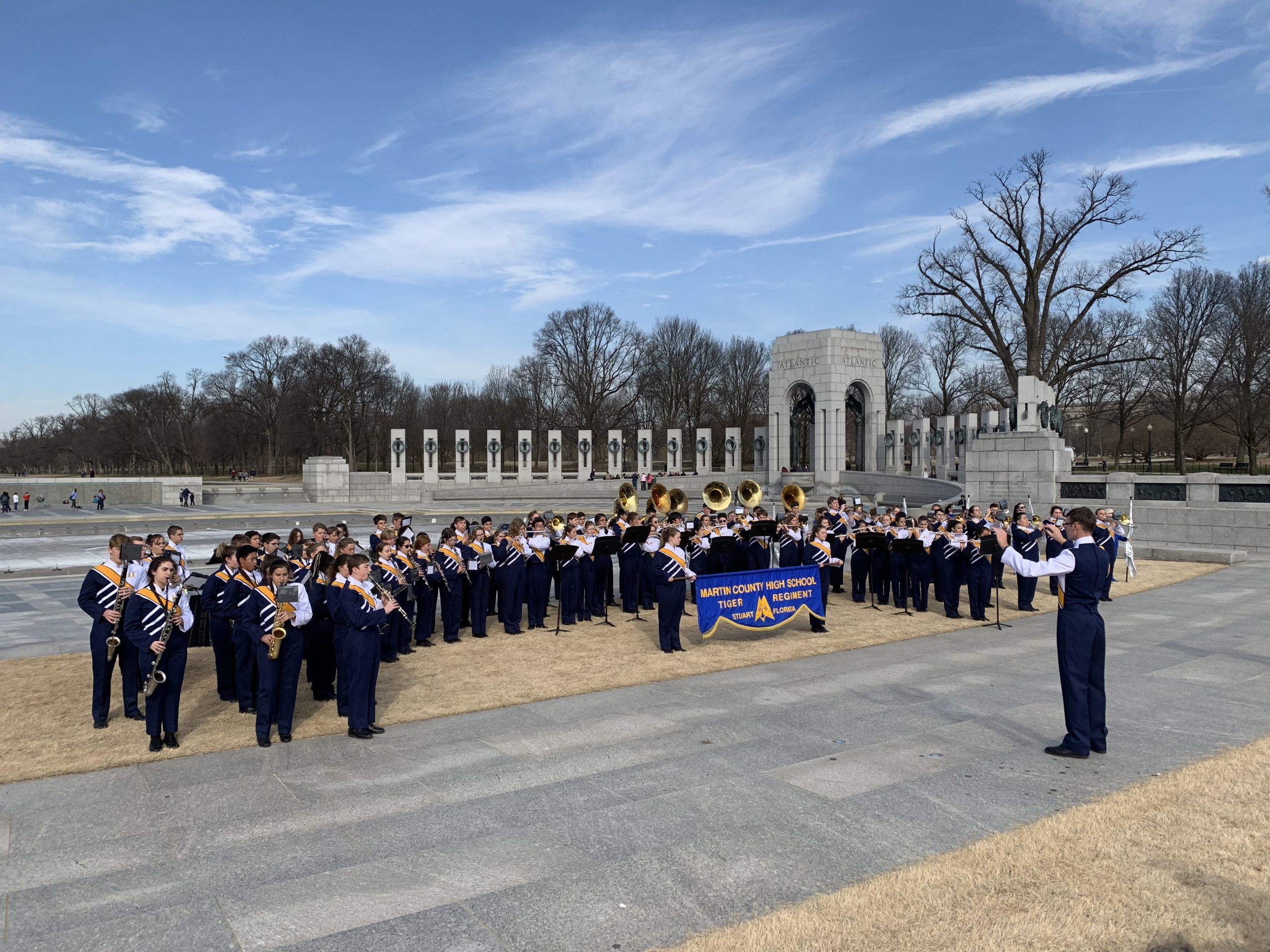 middle school student band performing in the Washington DC memorial strip