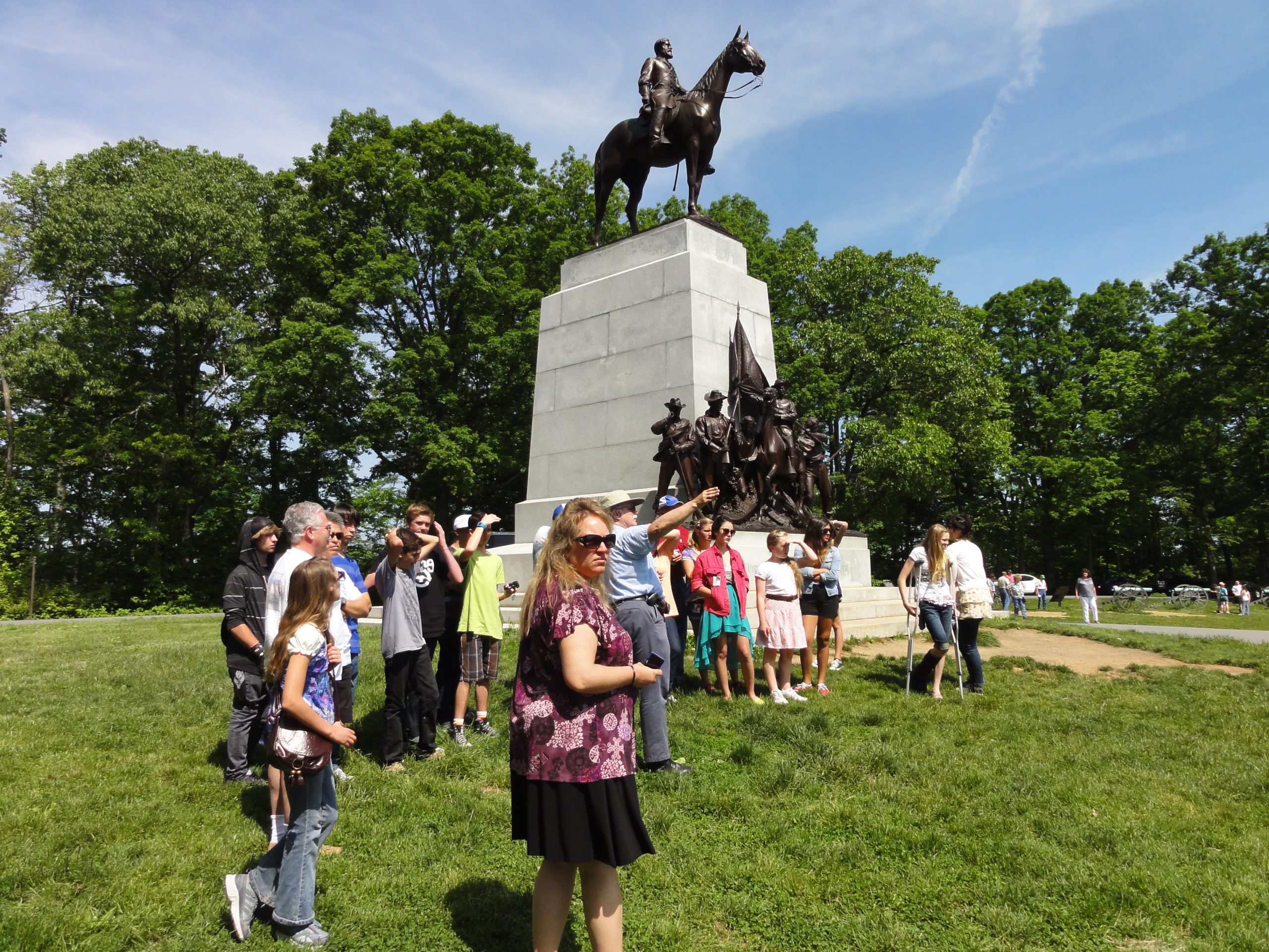 Group of students and teachers standing in front of civil war monument in Washington DC