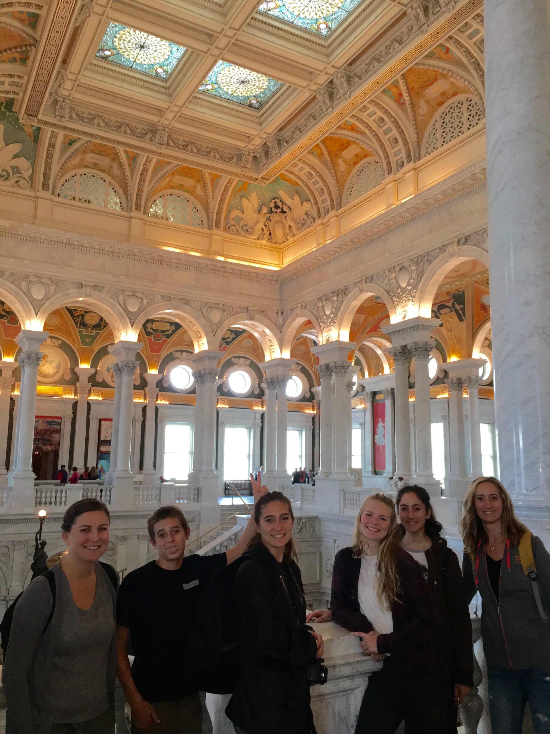 Five high school students posing on balcony in the Congress Library building