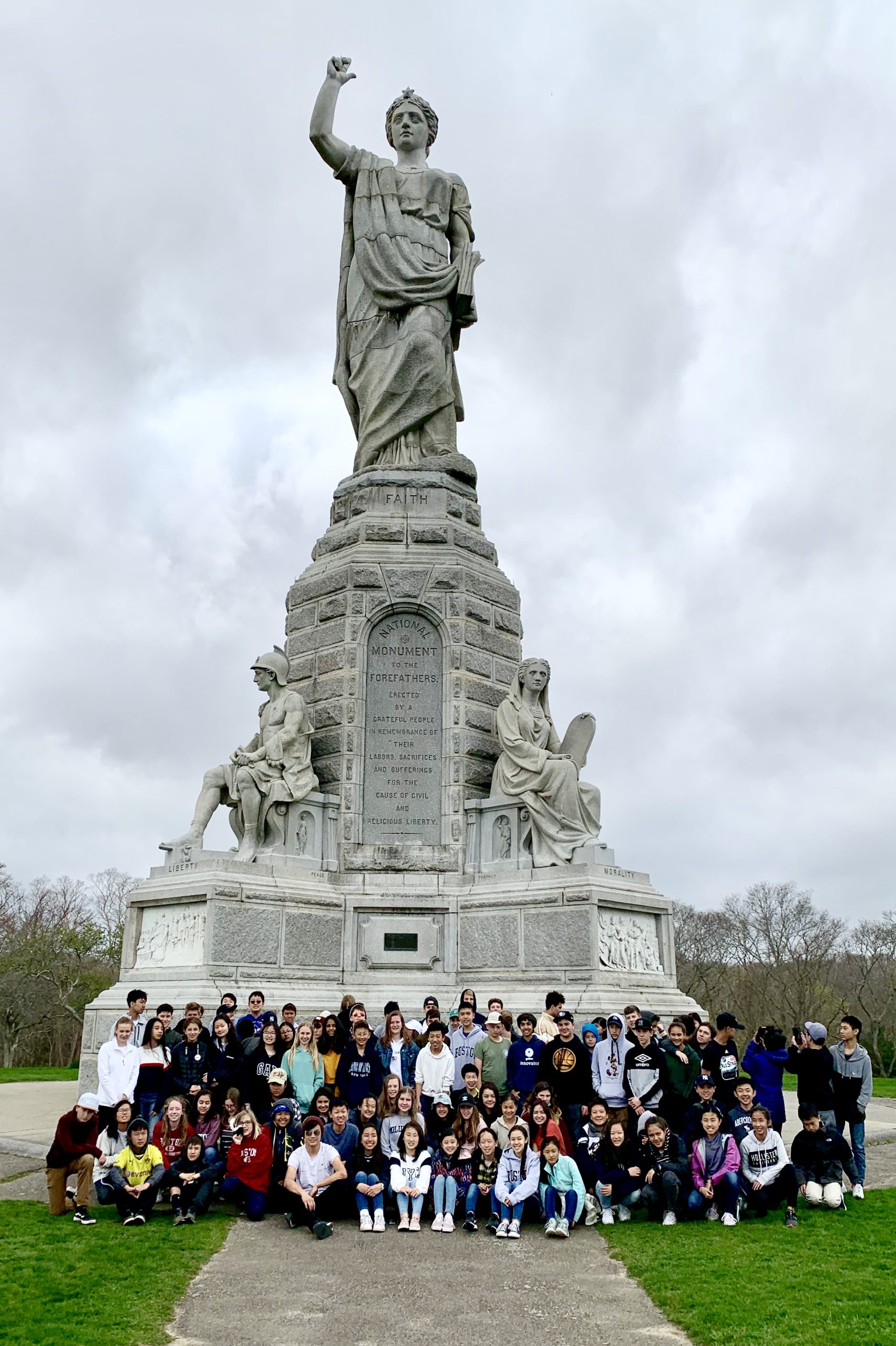 Group of students posing in front of Founders Monument in Plymouth MA