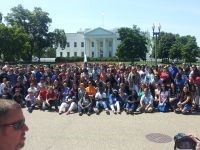 large group of students posing in front of the White House in Washington DC