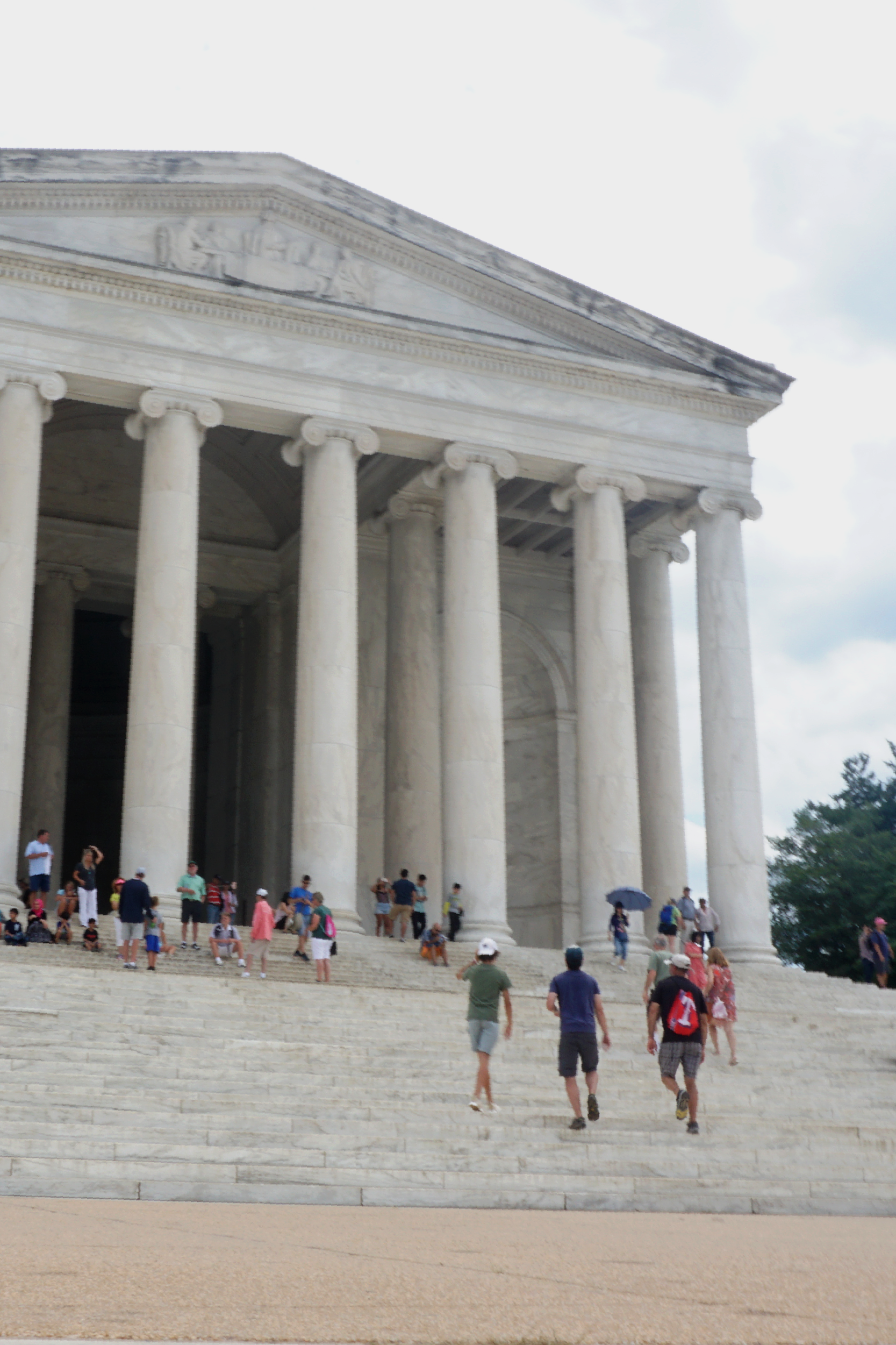 students walking up the steps of the Thomas Jefferson Memorial in Washington D.C.